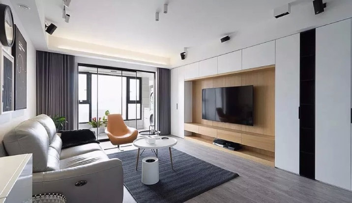 Mounted TV on a wall in the living room of a modern home.
