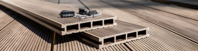 Two loose composite decking panels on top of a deck