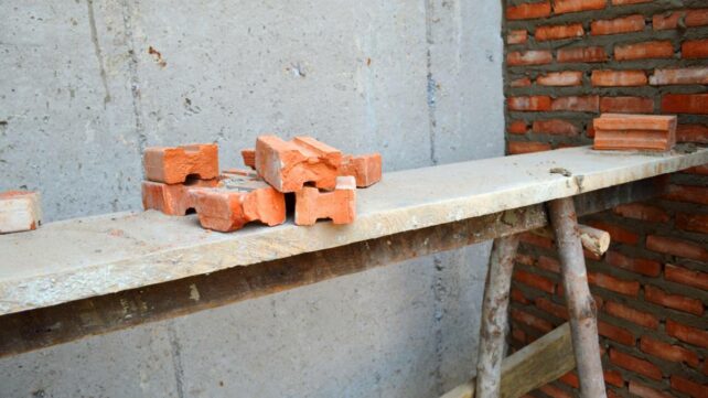 bricks on top of a wood in a construction site