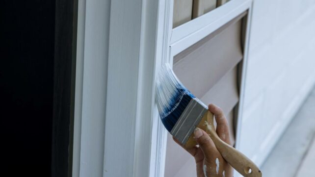 painting mouldings and trims white using a paintbrush