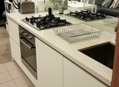 A bright and airy, this modern kitchen features clean lines, white cabinets, and an open concept design - oven installation cost