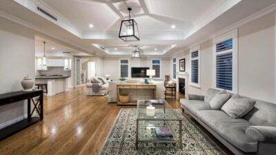 A spacious, open-plan living room with hardwood floors - house cleaning cost